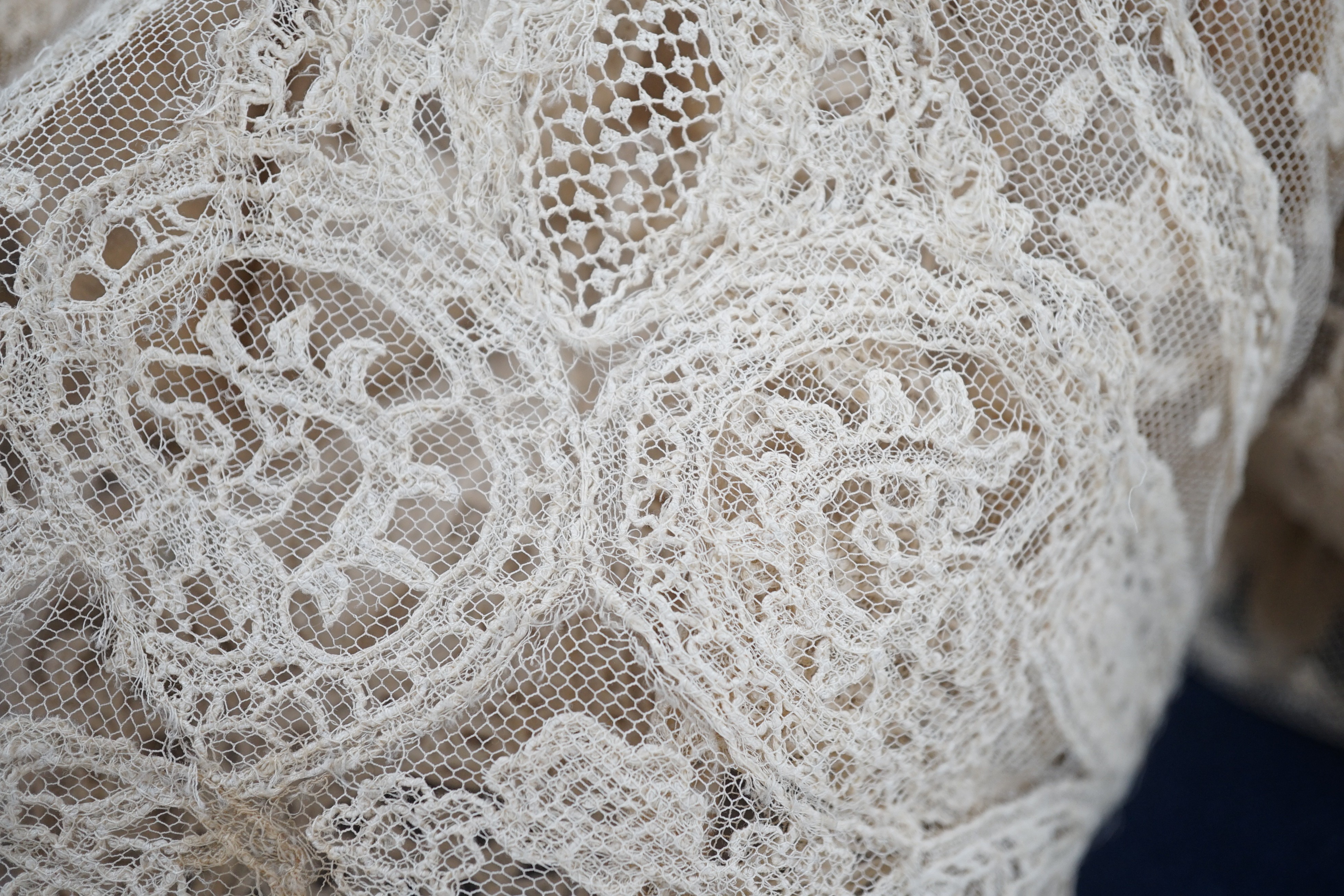 A rare length (9 and a half yards) of Brussels 19th century needle lace, some repairs and damage, circa 1880 and a similar wedding veil